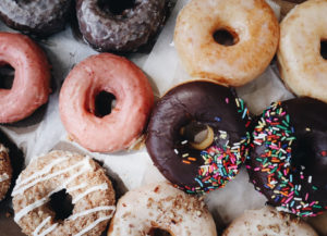 Box of Donuts With Different Varieties. Sprinkles and Glazed